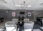 Thumbnail 5 of 41 - A room with grey walls and a pool table.