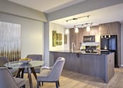 Thumbnail 12 of 41 - a modern kitchen and dining room.
