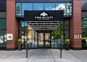 Thumbnail 23 of 41 - The entrance to a building with a sign that reads "The Scott".