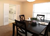 Thumbnail 19 of 19 - Spacious dining room and bright white kitchens at Plantation apartments in Houston.