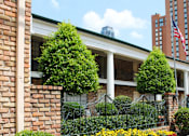 Thumbnail 5 of 19 - Apartments near the Galleria with brick exteriors, covered parking and courtyard setting at Plantation apartments in Houston.