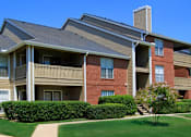 Thumbnail 14 of 30 - Luxury apartments with red brick exteriors, beautiful landscaping, and spacious balconies at Preston Village Apartments in North Dallas