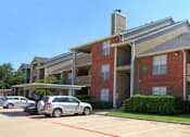 Thumbnail 9 of 30 - Luxury apartments with red brick exteriors, beautiful landscaping, and spacious balconies at Preston Village Apartments in North Dallas