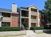 Thumbnail 24 of 30 - Luxury apartments with red brick exteriors, beautiful landscaping, and spacious balconies at Preston Village Apartments in North Dallas