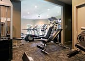 Thumbnail 27 of 30 - Luxury apartments with a fitness center in a gated community at Preston Village Apartments in North Dallas