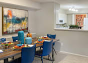 Thumbnail 23 of 30 - Spacious apartments with dining room and kitchen with white cabinets at Preston Village Apartments in north Dallas