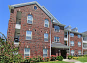 Thumbnail 15 of 31 - Luxury apartments with red brick exteriors, beautiful landscaping, and scenic views at Rockledge Oaks Apartments in Lincoln, Nebraska