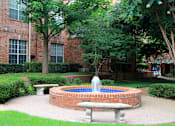 Thumbnail 12 of 73 - Gated apartment community with landscaped courtyards, beautiful landscaping, and beautiful courtyards with fountains at The Saxony Apartments in north Dallas