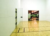 Thumbnail 58 of 73 - Racquetball court and large fitness center at The Saxony Apartments in north Dallas