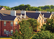 Thumbnail 34 of 38 - Luxury apartments with red brick exteriors, spacious balcony, and lush landscaping at TurtleCreek apartments in West Des Moines, Iowa