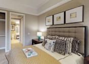 Thumbnail 14 of 26 - Spacious master bedroom with attached walk-in closet and master bathroom at RidgeGate Apartments in Minnetonka, Minnesota