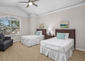 Thumbnail 24 of 34 - Huge bedroom, spacious bedroom with vaulted ceiling, ceiling fan, walk-in closet, and attached bathroom at Tuscany Row Townhomes in Houston.