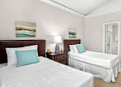 Thumbnail 21 of 26 - Huge bedroom, spacious bedroom with vaulted ceiling, ceiling fan, walk-in closet, and attached bathroom at Tuscany Villas in Houston.