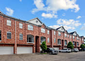 Thumbnail 34 of 34 - Luxury townhomes in a gated community with red brick exteriors and attached 2-car garages at Tuscany Row Townhomes in Houston.