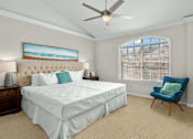 Thumbnail 27 of 34 - Huge master bedroom, spacious master bedroom with ceiling fan, high vaulted ceiling, over-sized windows, walk-in closet and attached luxury bath suite at Tuscany Row Townhomes in Houston.