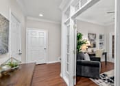 Thumbnail 30 of 34 - Huge office space, spacious den with built-in shelves, hardwood floors, and private backyard patios at Tuscany Row Townhomes in Houston.