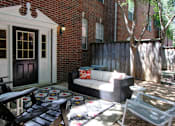 Thumbnail 5 of 26 - Private backyard patios and red brick exteriors at Tuscany Villas in Houston.