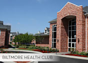 Thumbnail 15 of 36 - A red brick building with the words Biltmore Health Club on it.