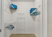 Thumbnail 21 of 40 - Large walk-in closet at Village on the Parkway Apartments in Houston Texas