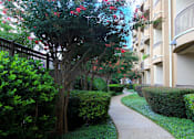 Thumbnail 10 of 36 - Luxury apartments next to the Galleria in Dallas with beautiful landscaping and spacious balconies at Villa Piana Apartments in Dallas