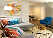 Thumbnail 2 of 22 - Spacious one and two bedroom floor plans with white brick accent walls and wood plank floors at Waters of Winrock Apartments in Houston.