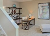 Thumbnail 22 of 42 - Spacious den or office area with 9-foot ceilings at Woodlake on the Bayou Apartments in Houston.