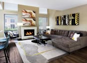 Thumbnail 1 of 42 - Spacious floor plan with wood-burning fireplace, breakfast bar, oversized windows and wood plank floors at Woodlake on the Bayou Apartments in Houston