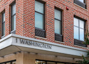 Thumbnail 9 of 16 - A building with a sign that says "1 Washington".