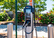Thumbnail 11 of 12 - An electric vehicle charging station is located in a park.
