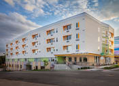 Thumbnail 5 of 13 - Property Exterior at Arroyo Village Apartments, Denver