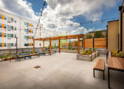 Thumbnail 4 of 13 - Courtyard Patio at Arroyo Village Apartments, Denver, Colorado