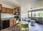 Thumbnail 11 of 13 - Dining And Kitchen at Arroyo Village Apartments, Denver, Colorado