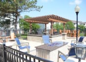 Thumbnail 8 of 39 - Fire Pit and Grill Area at Remington Apartment Homes, Romeoville, IL, 60446