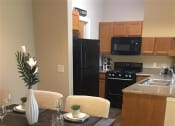 Thumbnail 17 of 39 - Model Kitchen at Remington Apartment Homes, Romeoville, Illinois