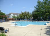 Thumbnail 10 of 39 - Pool Area at Remington Apartment Homes, Romeoville, IL