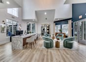 Thumbnail 16 of 27 - a living room with a bar and chairs and a kitchen  at Vibe on Riverside, Austin, TX, 78741