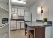 Thumbnail 6 of 8 - a kitchen with a counter top and a sink  at Waterford Studios, Texas, 78758