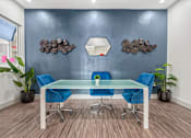 Thumbnail 3 of 13 - a conference room with blue chairs and a glass table  at Collective on Riverside, Austin
