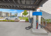 Thumbnail 23 of 26 - a gas station with a car in the background  at Presidium Revelstoke, Fort Worth, 76131