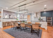 Thumbnail 15 of 26 - a large kitchen and dining room with a table and chairs  at Presidium Revelstoke, Fort Worth, TX, 76131