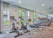 Thumbnail 26 of 26 - a gym with rows of exercise bikes and windows  at Presidium Revelstoke, Fort Worth