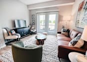 Thumbnail 36 of 111 - Living Room with a Grey Armchair at Hebron Station Apartments, Kentucky