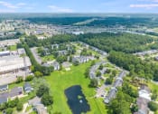 Thumbnail 31 of 32 - an aerial view of the campus with a lake in the foreground at Dothan Farms, Dothan, 36305