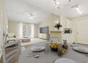 Thumbnail 20 of 24 - a living room and dining room with a table and chairs at Baldwin Farms Apartments, Robertsdale