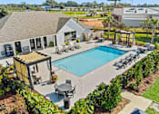 Thumbnail 7 of 24 - Pool And Exterior View at Baldwin Farms Apartments, Robertsdale, AL, 36567