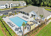 Thumbnail 5 of 24 - Drone View Of Pool And Exterior at Baldwin Farms Apartments, Alabama