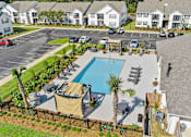 Thumbnail 8 of 24 - Drone View Of Pool at Baldwin Farms Apartments, Robertsdale
