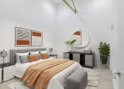Thumbnail 20 of 46 - a bedroom with a large bed and a mirror at The Mobile Lofts, Mobile, AL