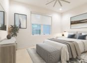 Thumbnail 21 of 46 - a white bedroom with a bed and a ceiling fan at The Mobile Lofts, Mobile, 36604