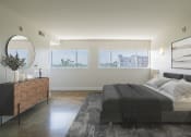 Thumbnail 6 of 46 - a bedroom with a bed and a dresser and three windows at The Mobile Lofts, Mobile, Alabama